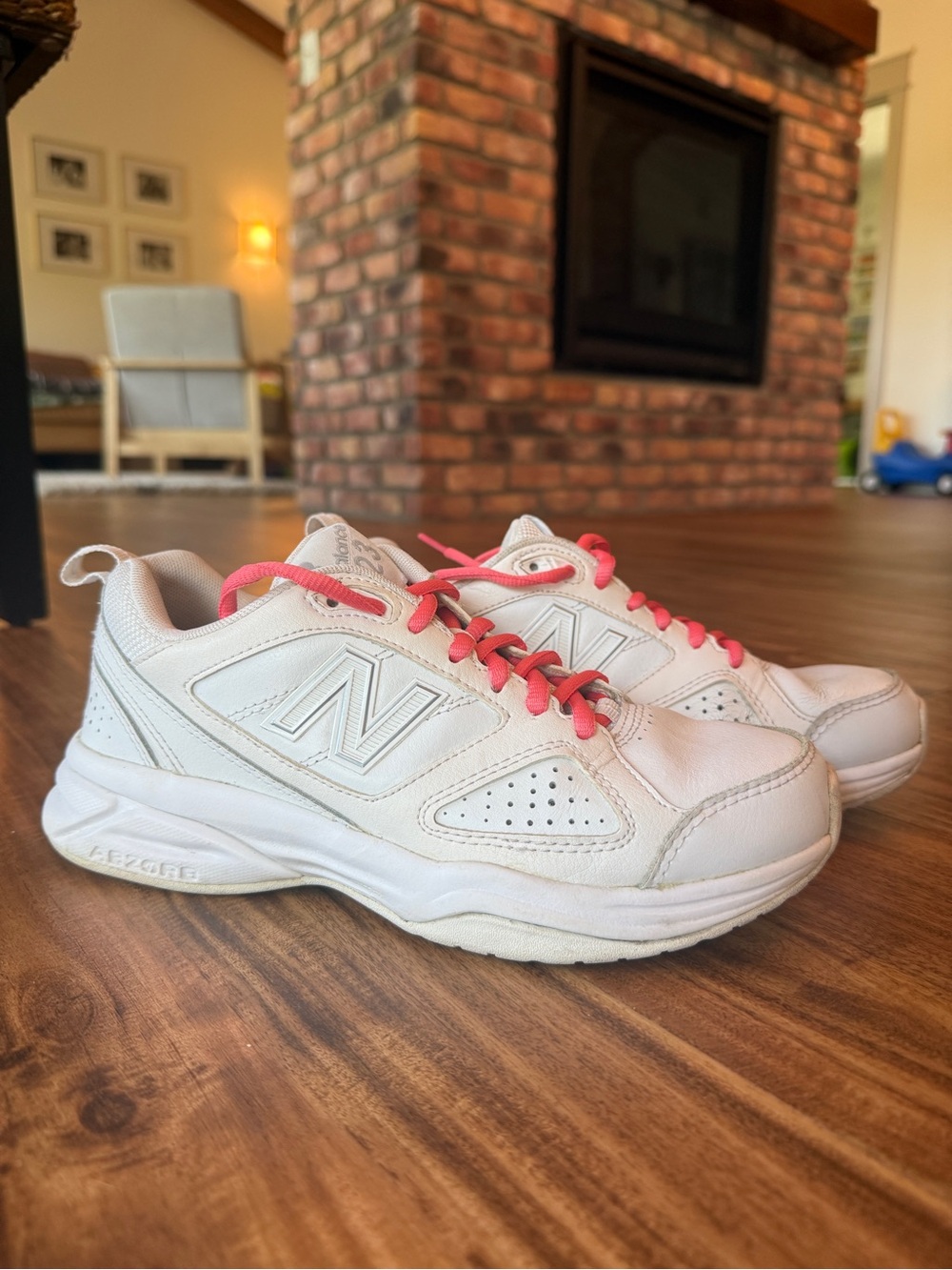 New Balance Women's White Leather Walking Sneakers with Pink Laces